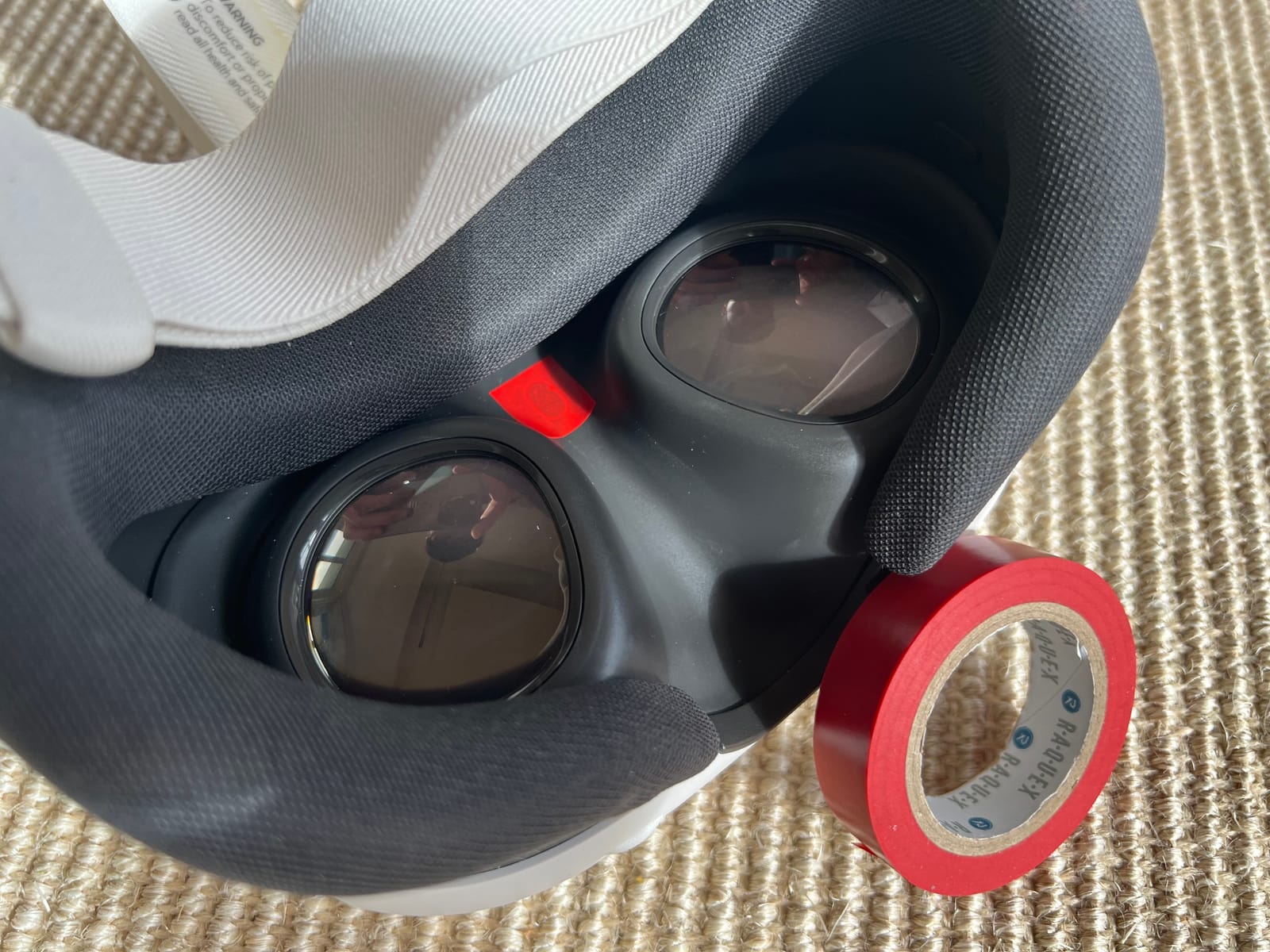 A small piece of tape covering the proximity sensor inside the headset